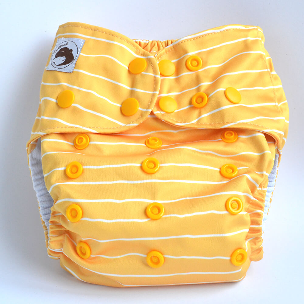 A yellow cloth nappy with white stripes.