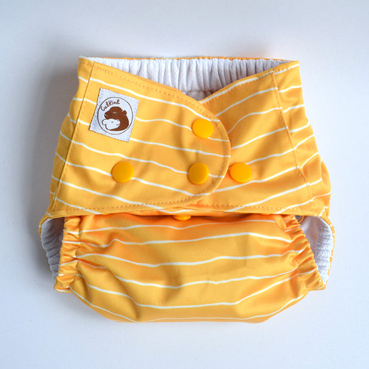 Cloth nappy set to the smallest settings using poppers.