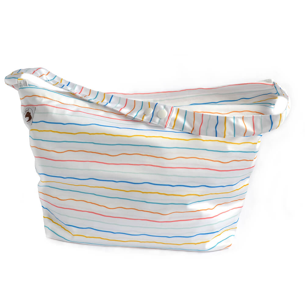 A large wetbag which is white with blue, yellow, orange and pink stripes.