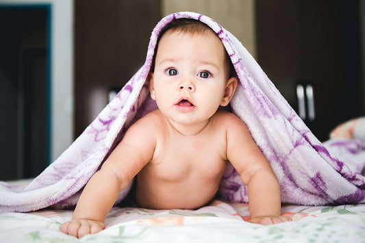 Baby toddler under blanket