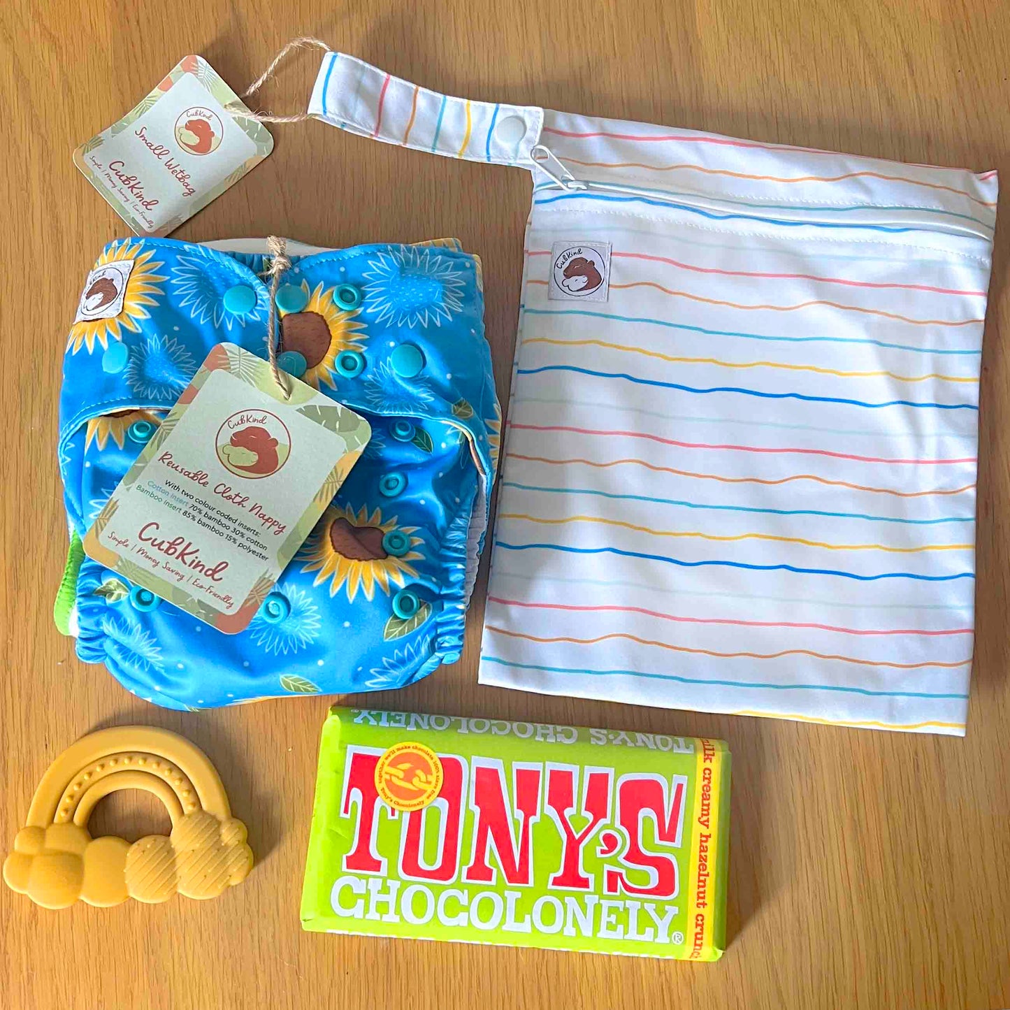 A reusable nappy, wetbag, teether and chocolate