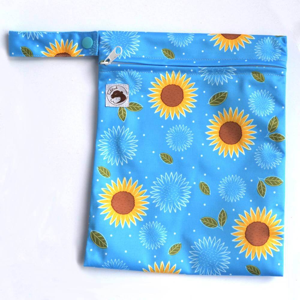 a blue small wetbag with sunflowers