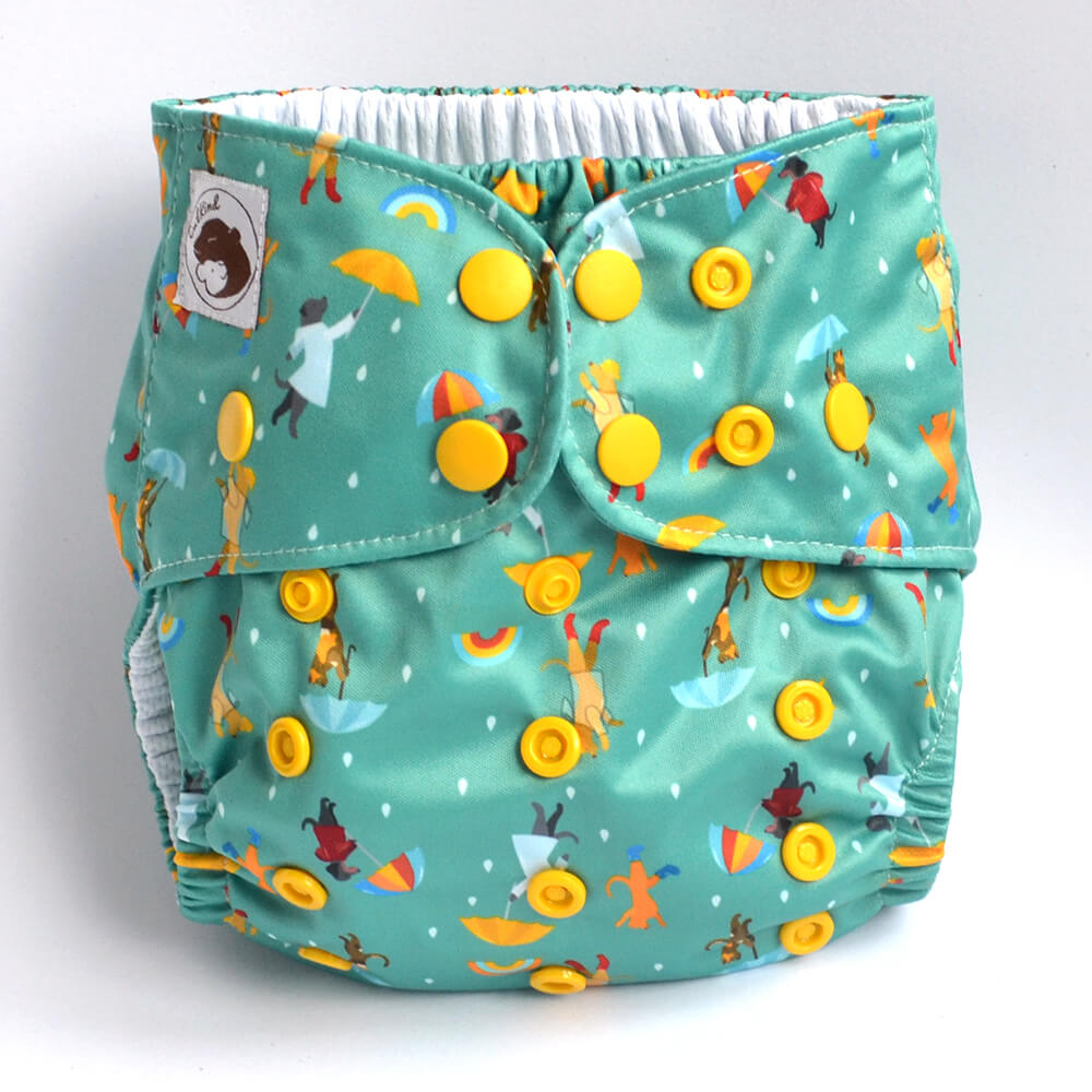 Green cloth nappy with cats and dogs holding umbrellas design.