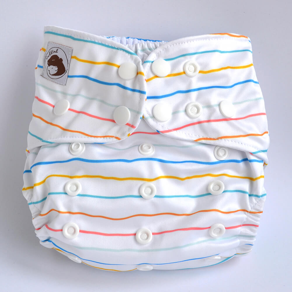 White cloth nappy with blue, yellow, green, orange and pink stripes.