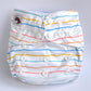 A white cloth nappy with blue, yellow, green, orange and pink stripes.