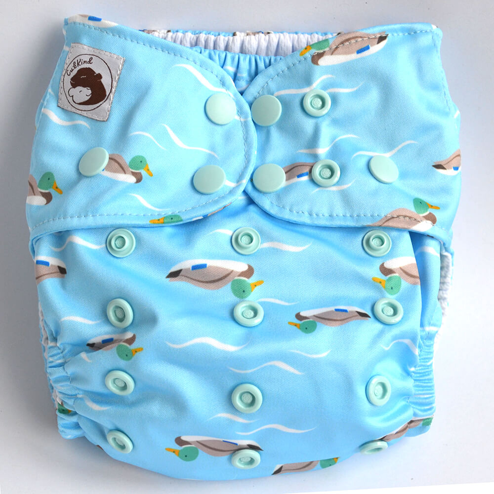 Blue cloth nappy with duck design.