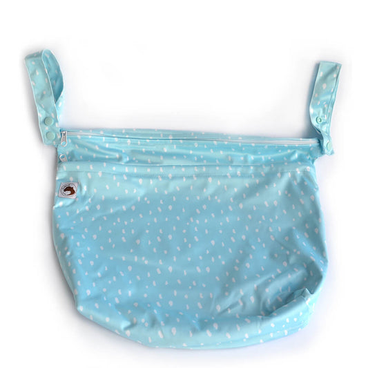 A large wetbag which is blue with white spots.